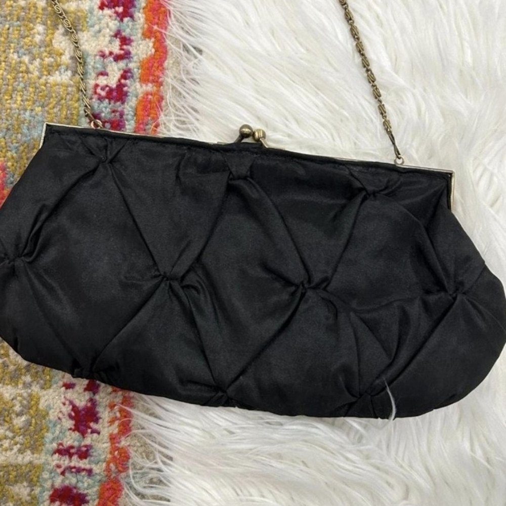 black hang bag with gold